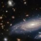 Teleskop Hubble temukan galaksi purba MXDFz4.4 berusia 12 miliar tahun yang mampu membentuk bintang 10 kali lebih cepat dari Bima Sakti.